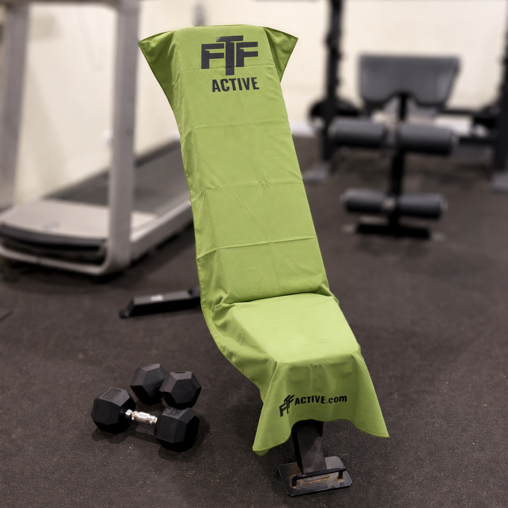 Olive Green BenchLock Hooded Gym Towel securely held in place on incline bench 